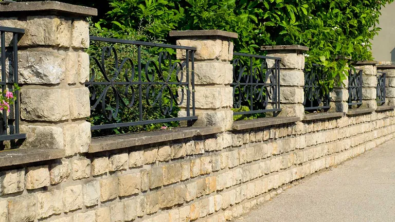 A fence on the top of a wall